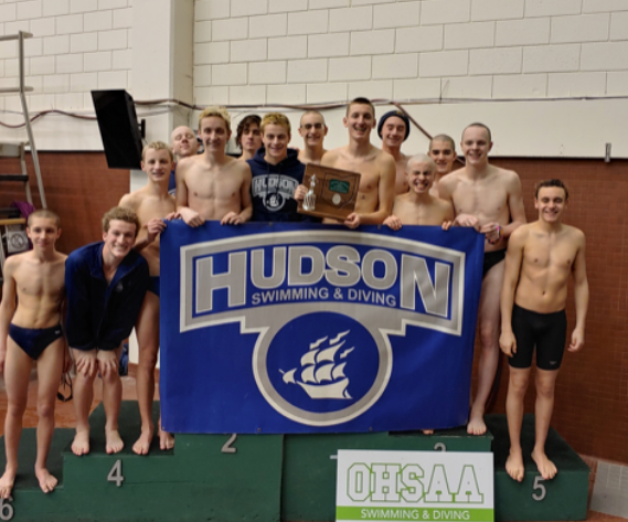 Hudson High School Boys Swimming and Diving Team Standing on the podium after the District Meet at Cleveland State’s Robert F. Busbey Natatorium.