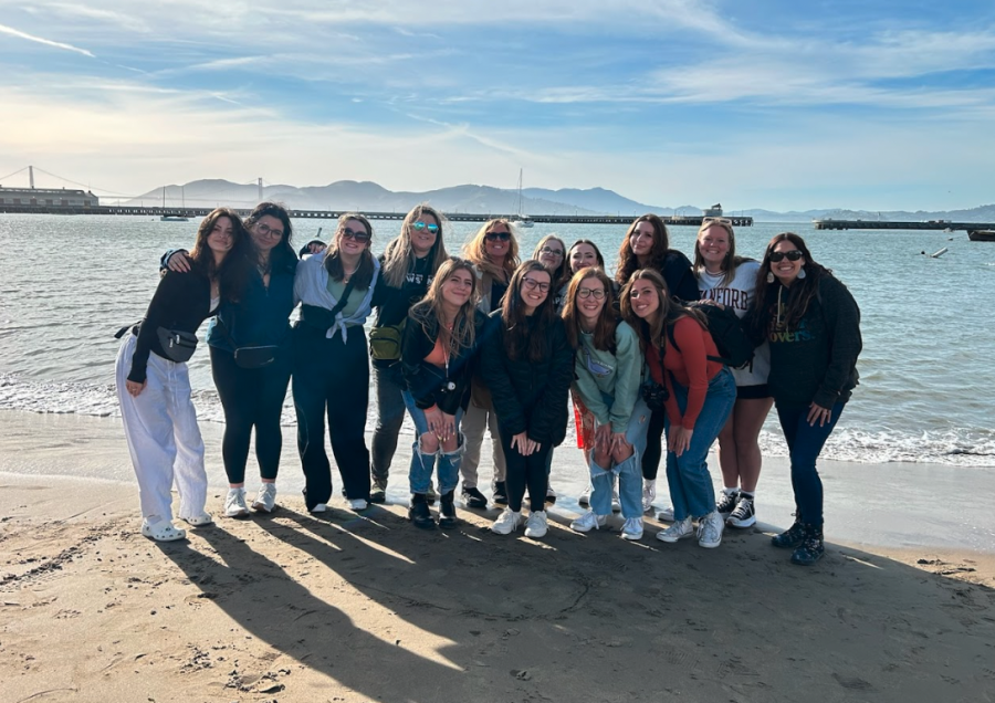 All the girls from the trip pose with the Golden Gate Bridge in the background.