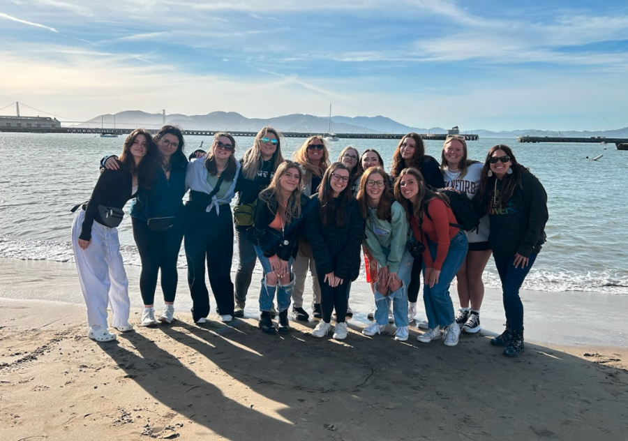 The girls from the trip pose with the Golden Gate Bridge in the background.