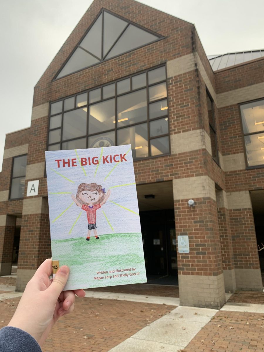 The physical copy of The Big Kick in front of Hudson High School