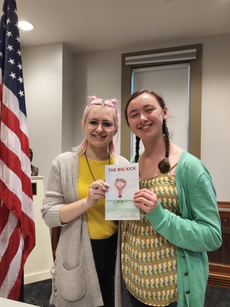 Author Megan Earp and Illustrator Shelly Grecol pose with The Big Kick after giving a speech on the book and Crohns at the Hudson Library. Used with permission/Megan Earp.