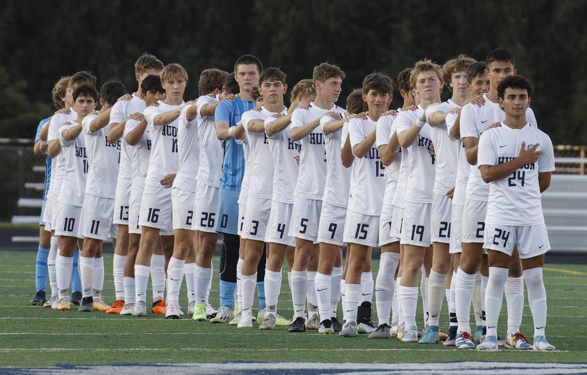 Hudson’s Varsity Boys Soccer team line-up for the national anthem prior to their second suburban league game against Twinsburg on Tuesday, Sep. 5, 2023. 
