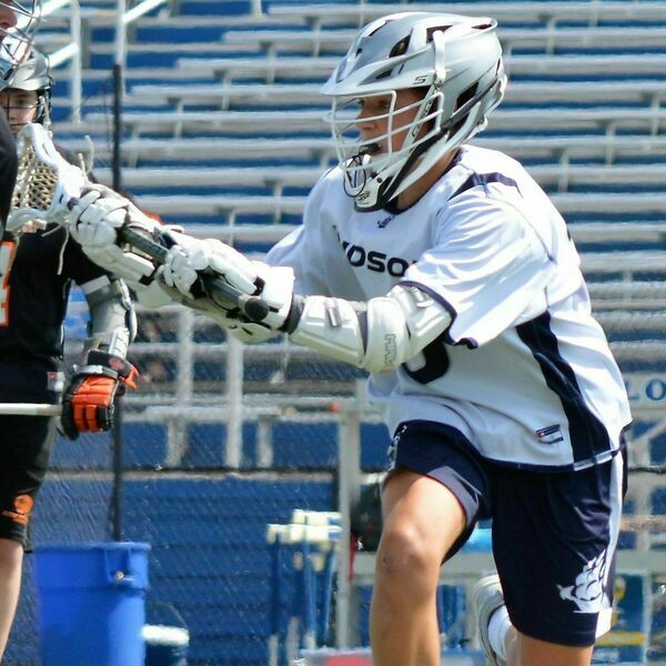 John Ploskunak plays in a Hudson High School lacrosse game. John played midfield for the high school last season.