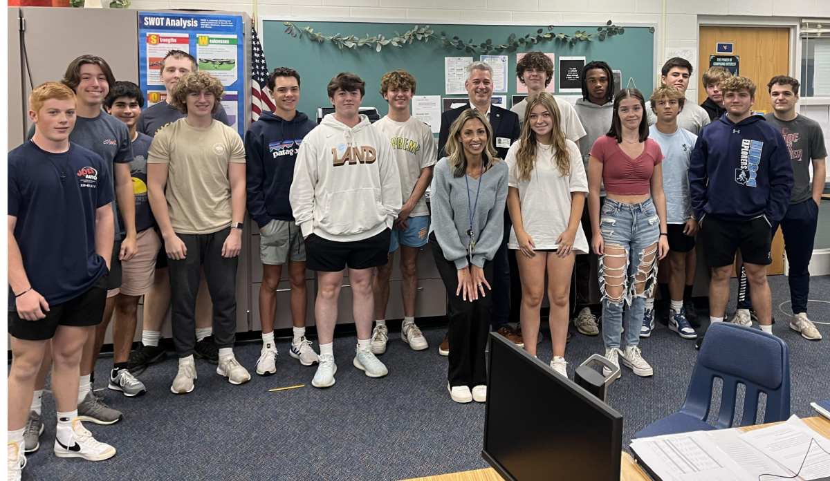 Mrs. Sutton and her students during her class of Principles of Investment Class with the Mayor of Hudson, Jeff Anzevino.