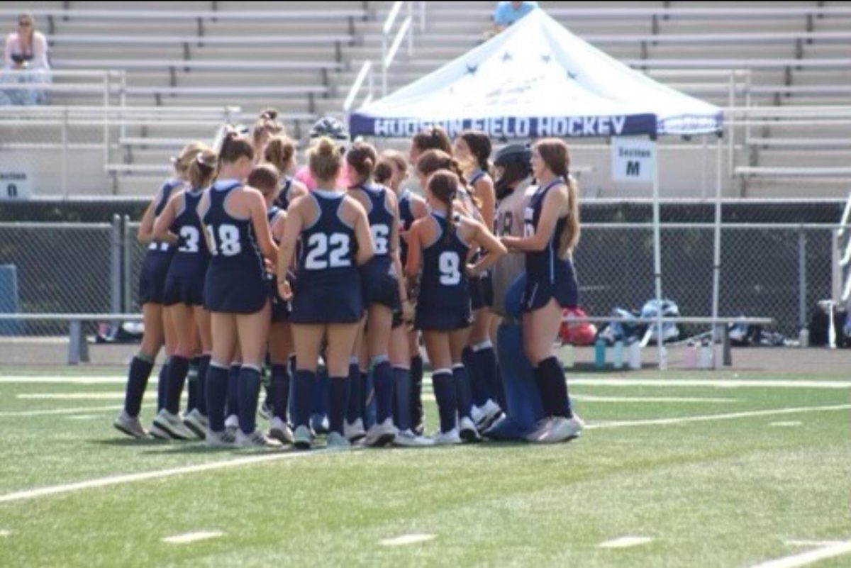 The JV field hockey team huddles before a scrimmage at North Allegheny High School. The team had worked hard to prepare for the season to start and it showed in the scrimmage with the final victory. 