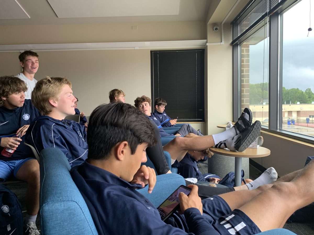Part of the Hudson Boys Soccer Team hanging out in the MAC before their game. Before home games, the varsity team sits in the MAC and watches the JV team play before they go out to warm-up.