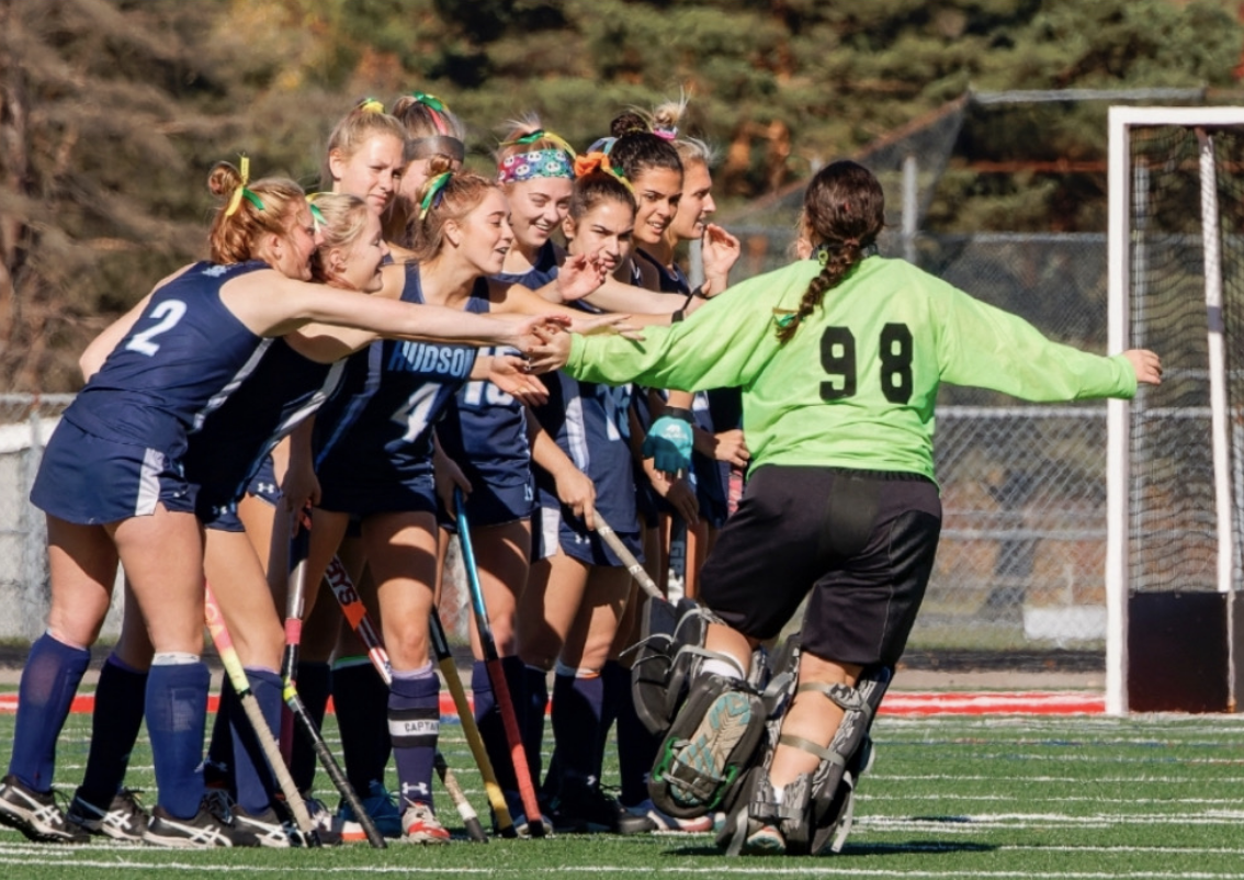 Karnofel high fives her teammates as she is announced in the starting lineup for the district final game of the 2022 season. The team would go on to play a hard fight in overtime, where they lost against their biggest rivals, Shaker Heights. 