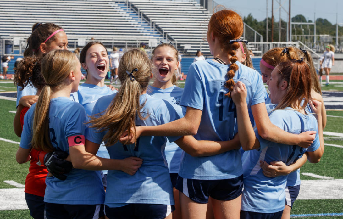 Members of the Hudson Girls Soccer team celebrate after a successful game.