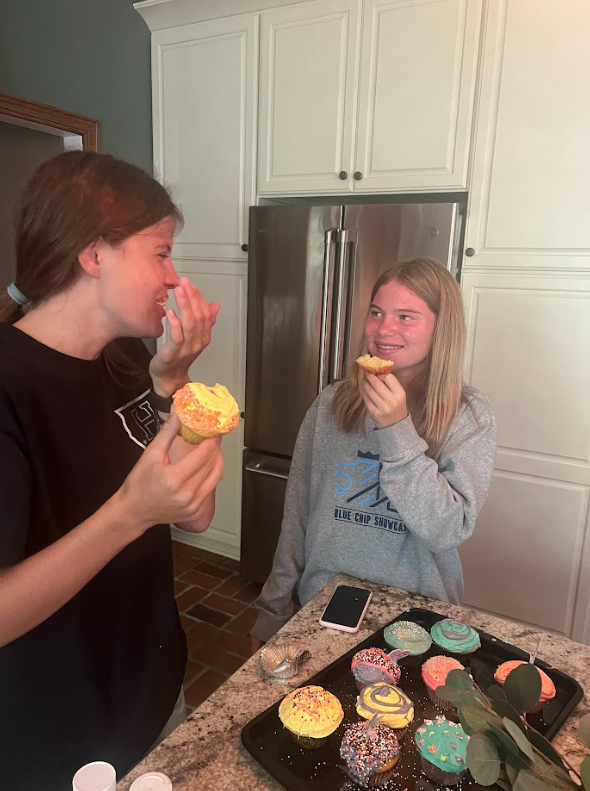 The girls are done baking and can now enjoy their creations together after a fun experience. 