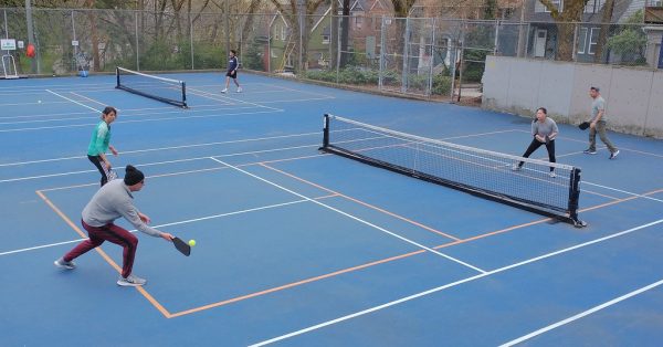 New pickleball fanatics play the game at a Community Center in America.