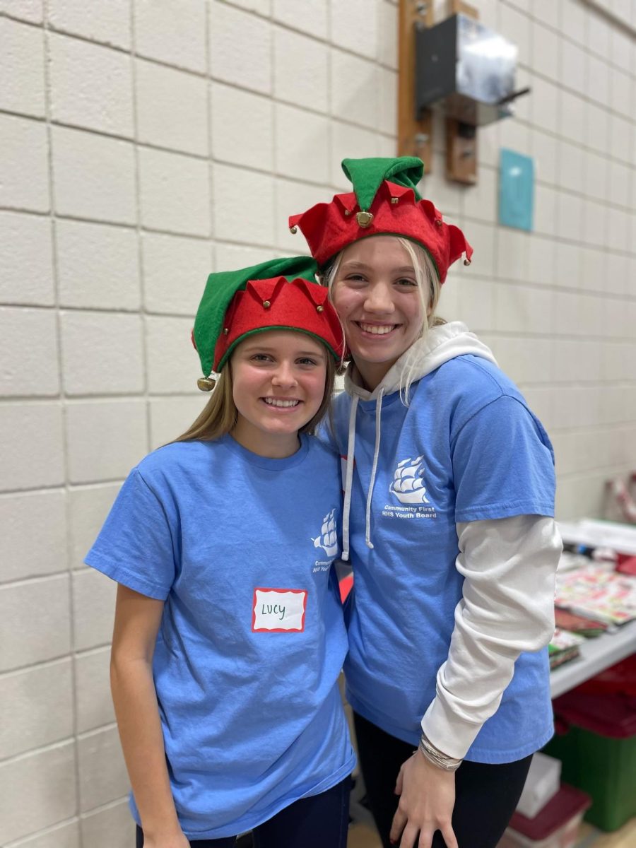 Addie Maxwell (right) with Sophomore Lucy Bechtel at East Woods working at the wrapping station of the Holiday Gift Shop last December. This is a yearly event that Hudson Community First participates in and is the perfect way to connect with the youth of Hudson. Used with permission/Addie Maxwell.