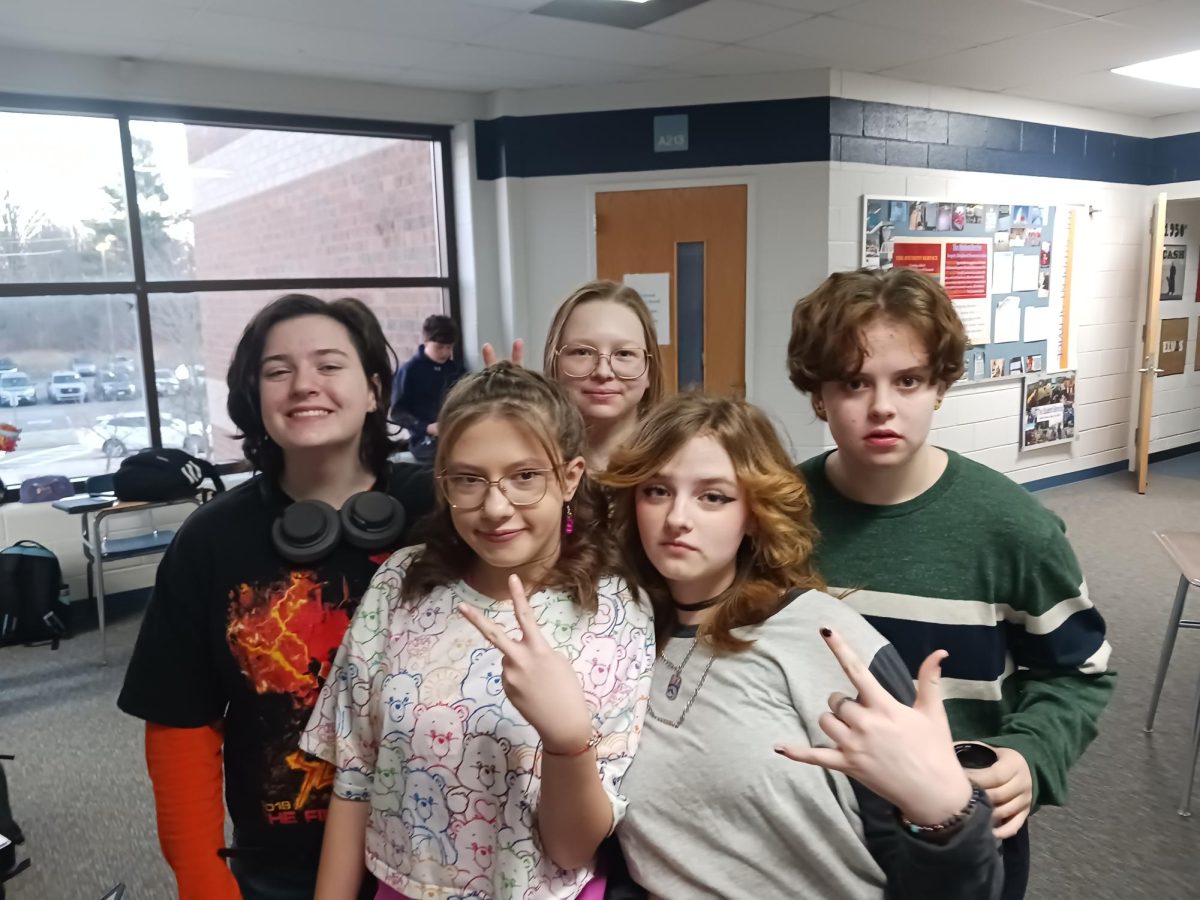 Freshmen Toby Davis, Samari Bowman, Sophie Daniel, Guinevere Marsh and Cody Schedler in the Social Studies hallway in the morning after a GSA meeting.