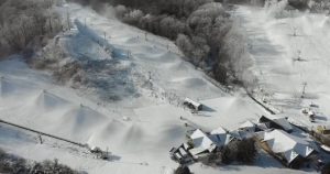 The snow machines work hard to produce enough powder for local skiers to head down the hills at Boston Mills. Since Vail Resorts purchased Boston Mills in 2019, prices have soared, making this once quaint ski area too much for locals to enjoy.