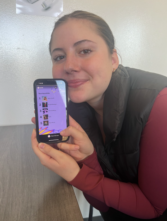 Sophomore McKenna Kiewatt posing by her Spotify Wrapped on the day it was released. She has participated in Spotify Wrapped for two years. Used with permission/McKenna Kiewatt.