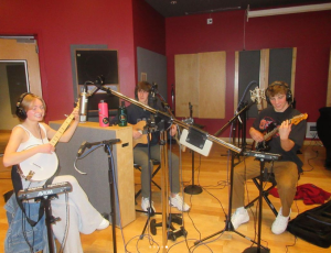 The band members rehearse in their studio. Used with permission/Floor Band Instagram.