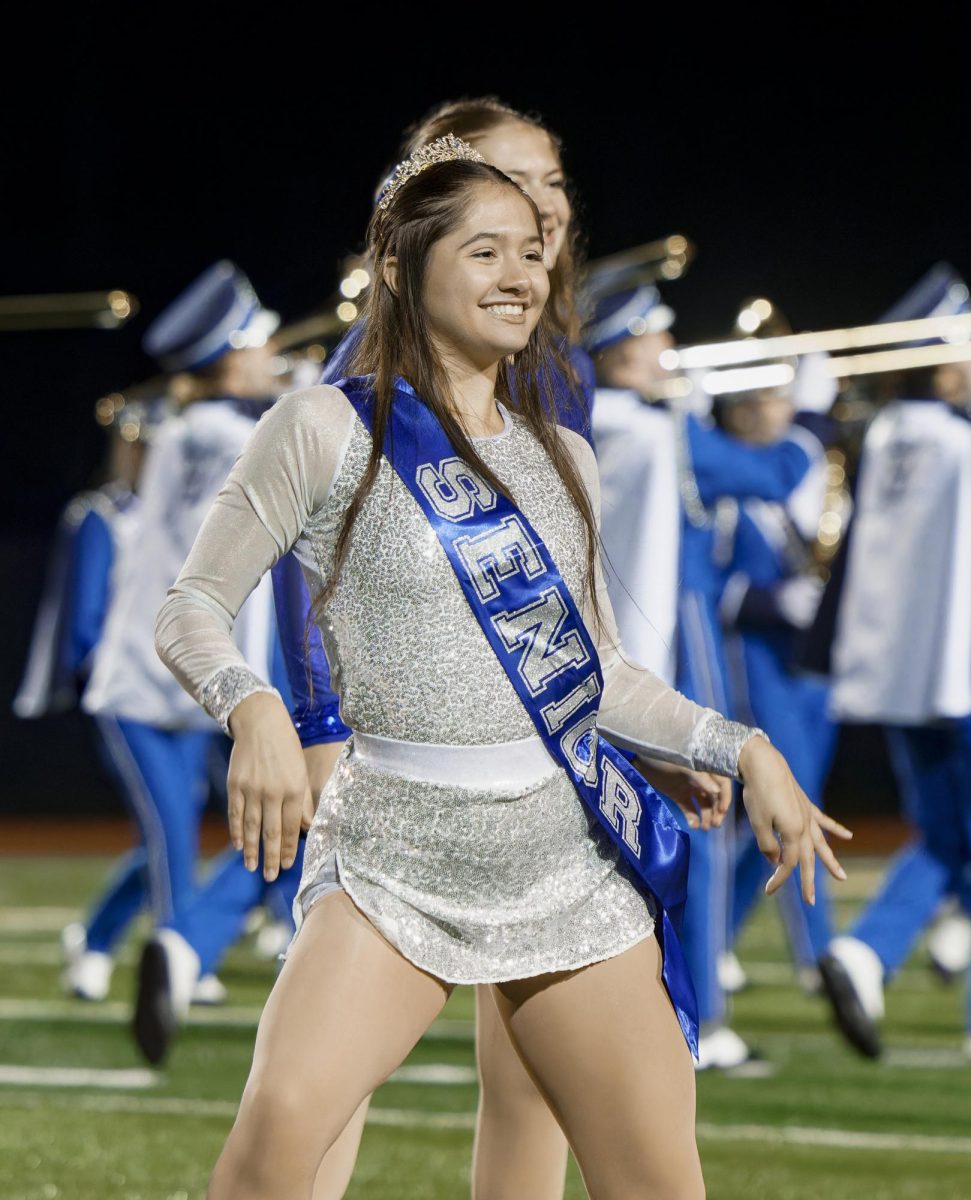 2025 graduating senior Alaina Walker dances on the HHS field for the last time on senior night Oct. 18 2024 alongside her band dance teammates. 