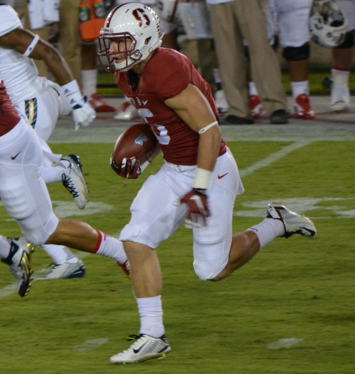 San Francisco 49ers running back Christian McCaffrey heads for the end zone to score a touchdown after catching the ball. 
