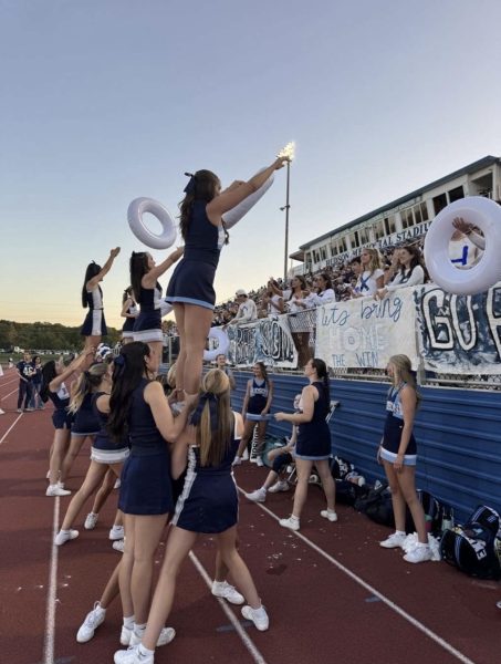 The cheer team taking on stunting for the white out homecoming game versus Solon High School. Taking place at Hudson High School on September 12th.
