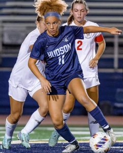 Number 11 Maya Lake live and in action kicking the soccer ball at Memorial Field during a game against Brecksville.
