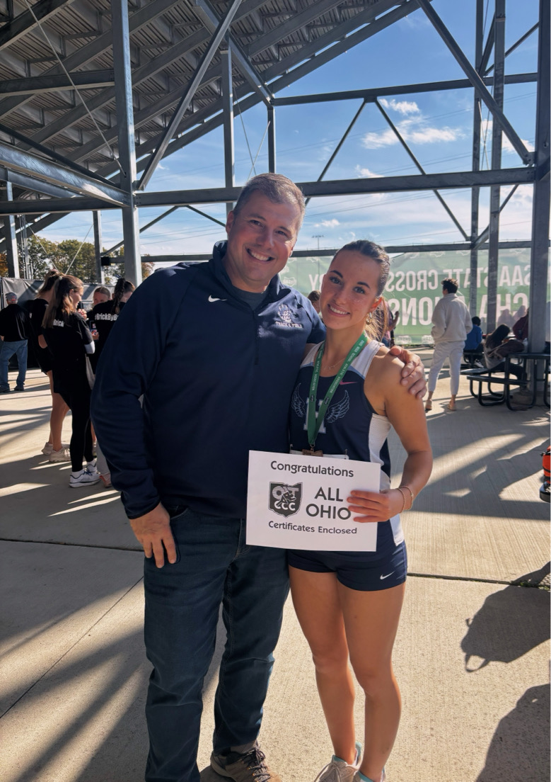 Capturing Jillian Paolucci and Dean Paolucci after her race in the states. This pictures her All-Ohio certificate and metal.